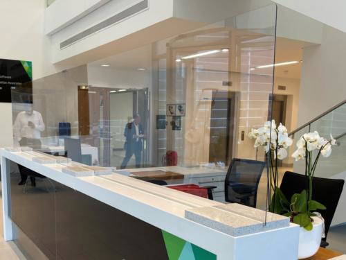 virus reduction Allder Group created these glass  reception screen 